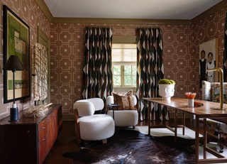 The earthy office is wrapped in McLaurin  Piercys Shinto grasscloth wallcovering with harlequinpattern curtains of a...